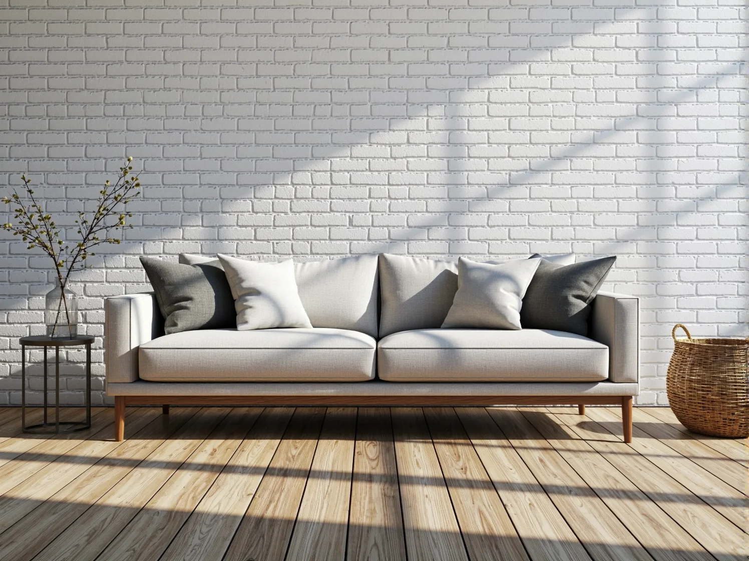 Jasne, minimalistyczne wnętrze z małą sofą i roślinami. Pomysł na przytulny kącik wypoczynkowy w małym mieszkaniu.